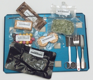 Bags of International Space Station food and utensils on a tray | Astronaut Chow: Space Food over the Years